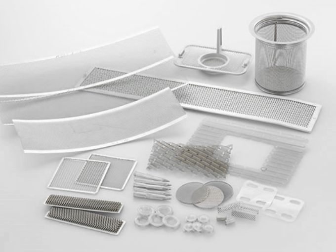 Several different shapes and sizes of micro expanded metal filter elements on the white background.