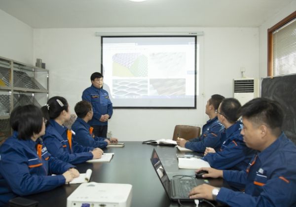 Several workers are in the meeting room and during training.